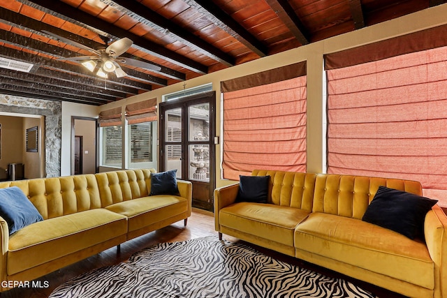 living area featuring wooden ceiling, beam ceiling, visible vents, and wood finished floors