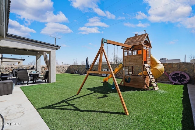 view of jungle gym with a fenced backyard, a lawn, and a patio