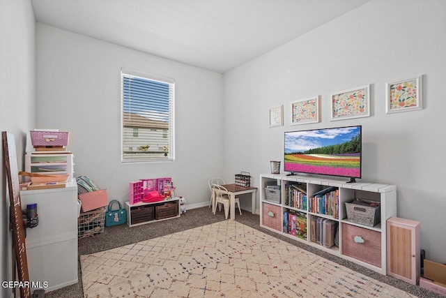 game room with carpet and baseboards