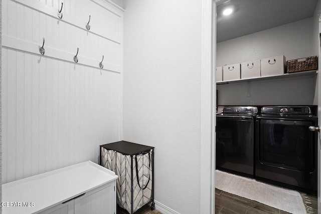 mudroom featuring separate washer and dryer and wood finish floors