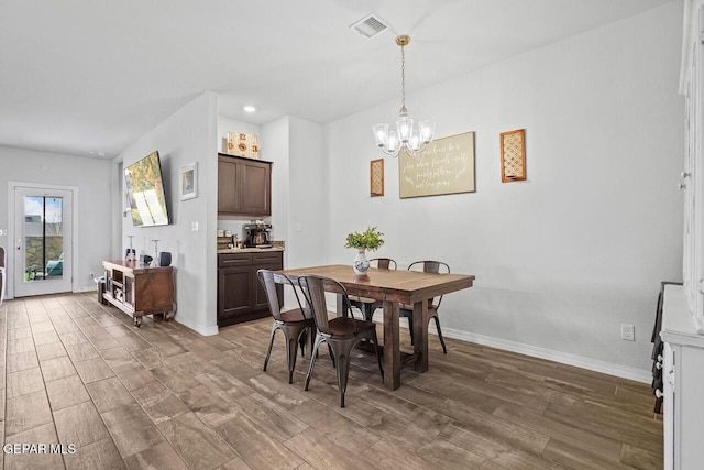 dining room with recessed lighting, visible vents, wood finished floors, a chandelier, and baseboards