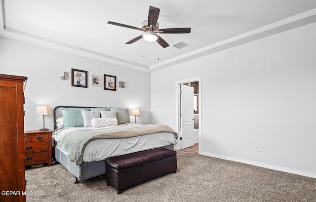 bedroom with baseboards, visible vents, a ceiling fan, a raised ceiling, and carpet flooring