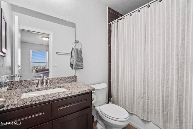 full bathroom featuring vanity and toilet