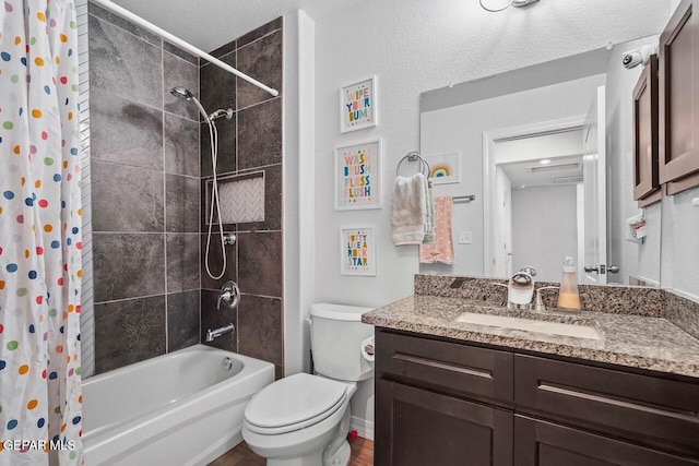 full bathroom featuring vanity, toilet, and shower / tub combo with curtain