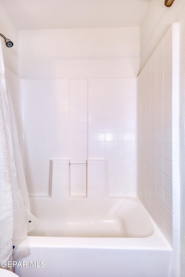 bathroom with shower / bath combo