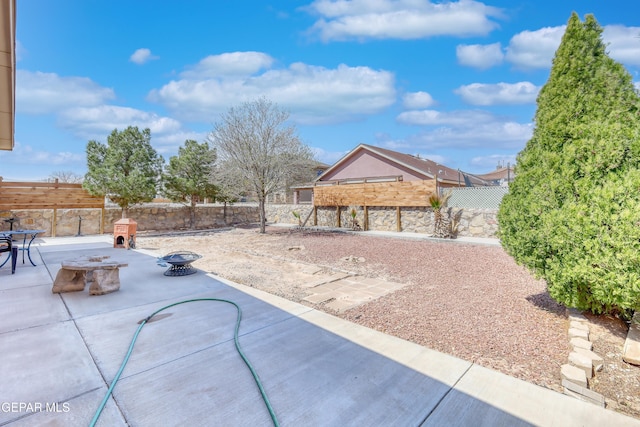 view of patio / terrace featuring a fire pit and a fenced backyard