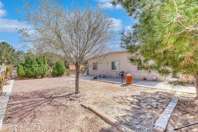 view of yard featuring a patio area and fence