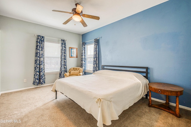 carpeted bedroom featuring a ceiling fan and baseboards