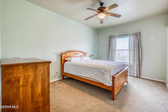 bedroom with baseboards, light colored carpet, and ceiling fan