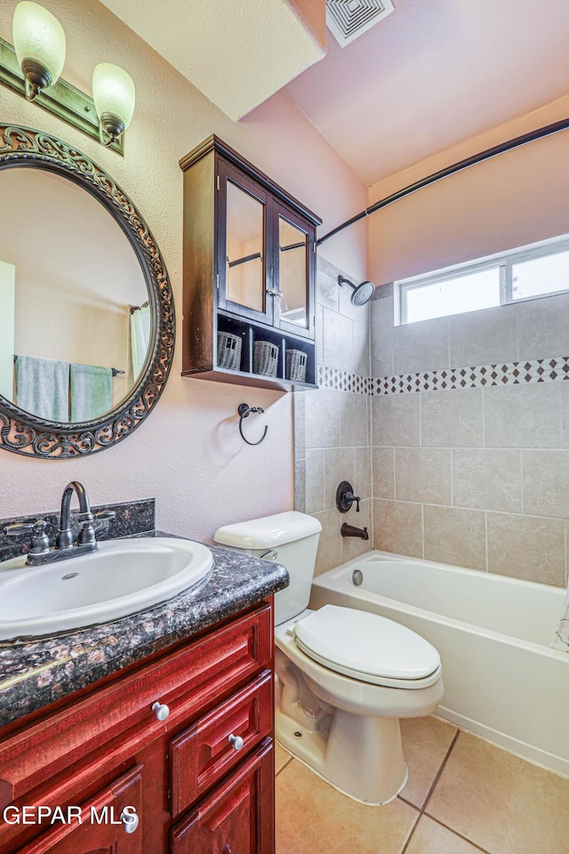 bathroom with vanity, visible vents, tile patterned flooring, shower / washtub combination, and toilet