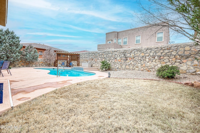 view of swimming pool featuring a yard, a patio, and a fenced in pool