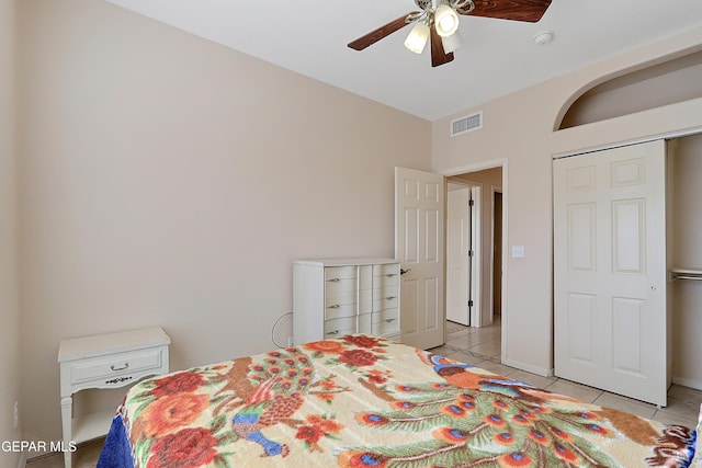 bedroom with light tile patterned floors, ceiling fan, and visible vents