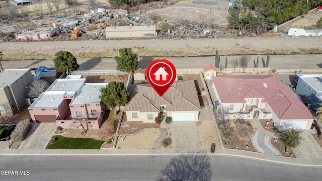 birds eye view of property with a residential view