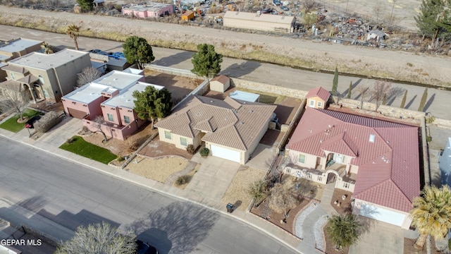 birds eye view of property with a residential view