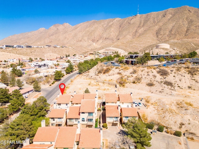 drone / aerial view featuring a residential view and a mountain view