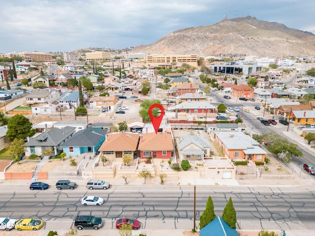 drone / aerial view featuring a residential view and a mountain view