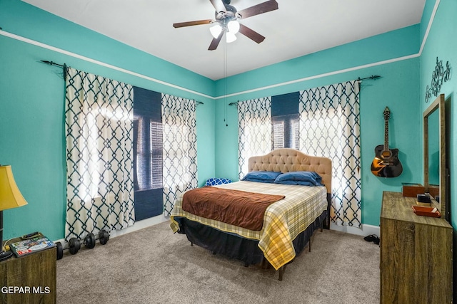 carpeted bedroom featuring ceiling fan