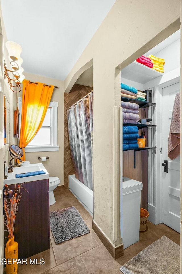 bathroom featuring shower / tub combo, vanity, and toilet