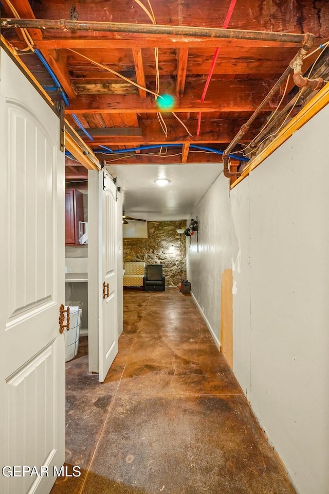 hall featuring concrete flooring