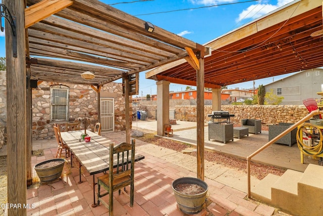 view of patio with outdoor dining space, fence, a grill, and a pergola