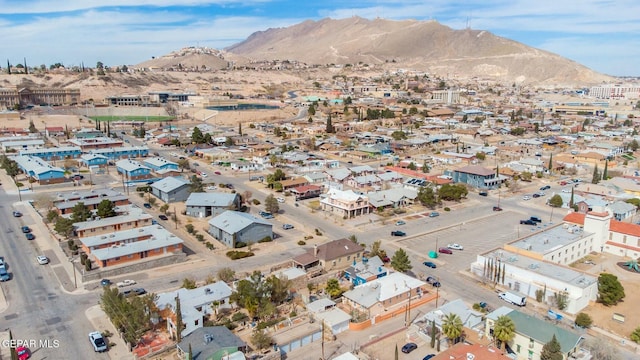 birds eye view of property with a residential view and a mountain view