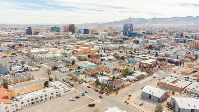 bird's eye view with a mountain view and a city view