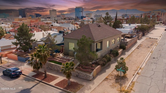 birds eye view of property featuring a view of city and a mountain view