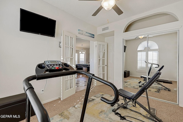 workout area with baseboards, visible vents, ceiling fan, carpet flooring, and french doors