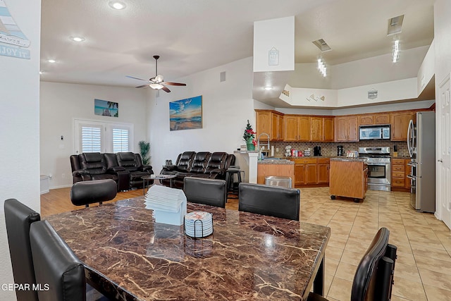 dining area with visible vents, ceiling fan, and light tile patterned floors