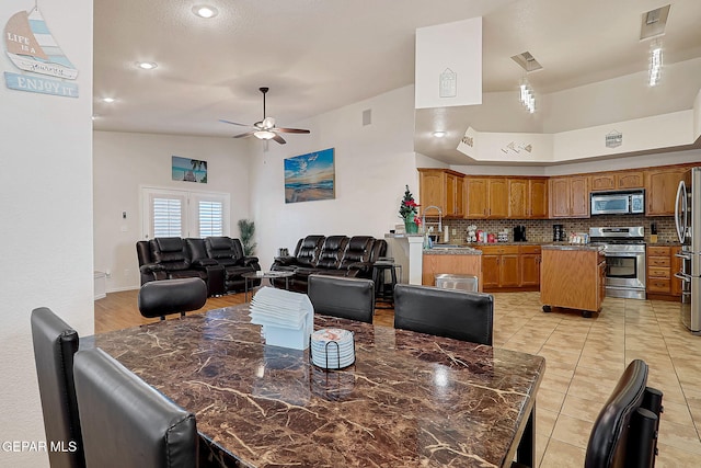 dining area with visible vents, ceiling fan, and light tile patterned floors