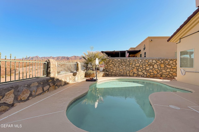 view of pool featuring a fenced in pool and a fenced backyard