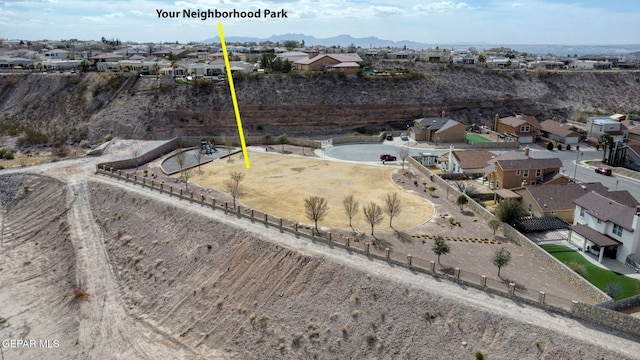 birds eye view of property featuring a residential view and a mountain view