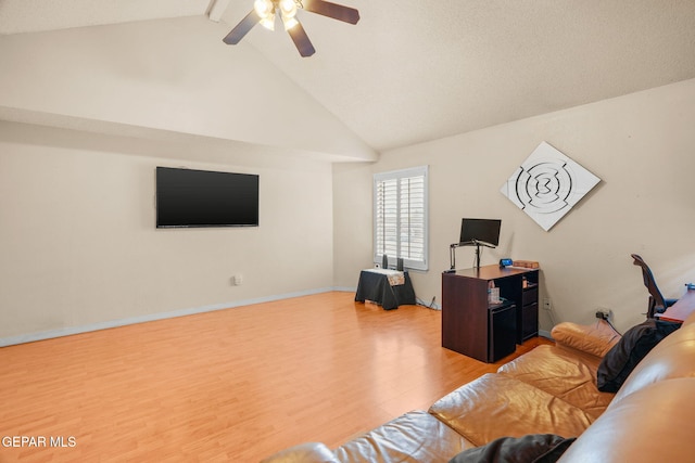 living room featuring high vaulted ceiling, wood finished floors, baseboards, and ceiling fan