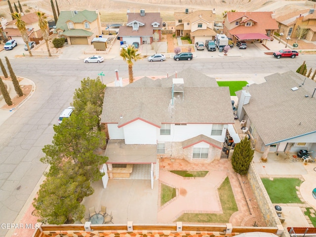 birds eye view of property with a residential view