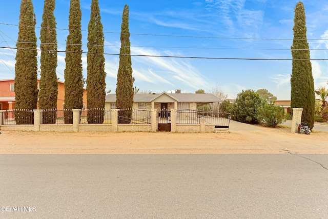 view of front of home featuring a fenced front yard and a gate