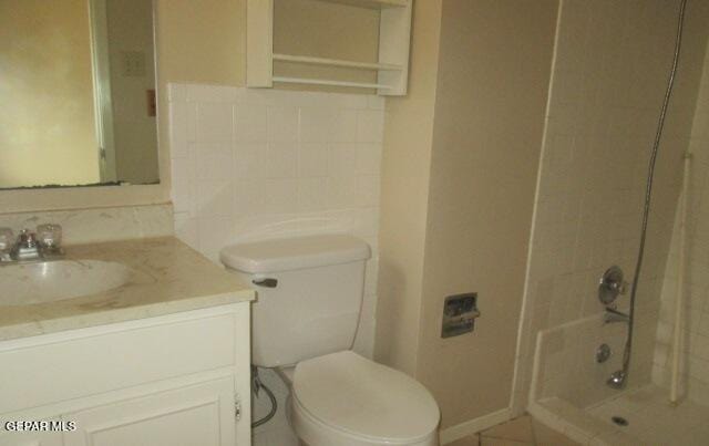 full bathroom with toilet, tub / shower combination, and vanity