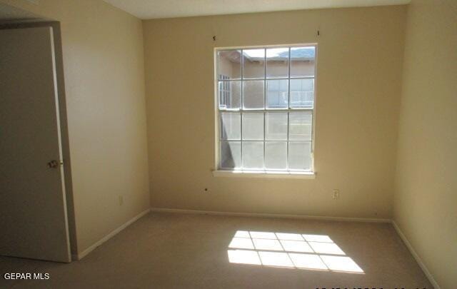 empty room with baseboards