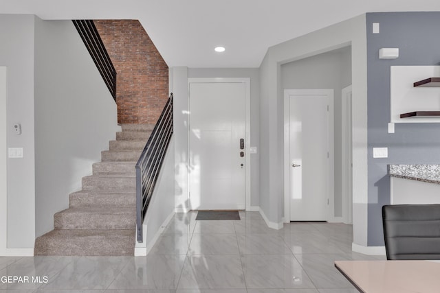 entrance foyer featuring recessed lighting, baseboards, and stairs