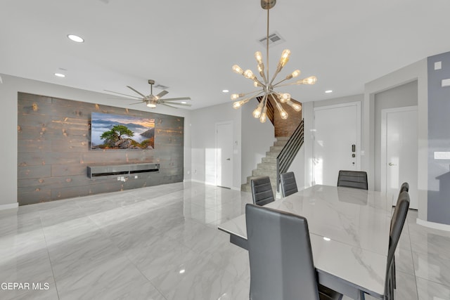 dining space featuring visible vents, an accent wall, marble finish floor, stairs, and recessed lighting