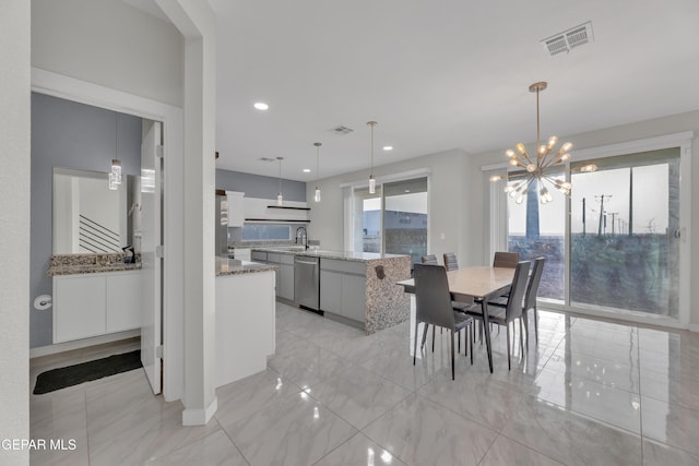 dining space featuring an inviting chandelier, visible vents, marble finish floor, and recessed lighting