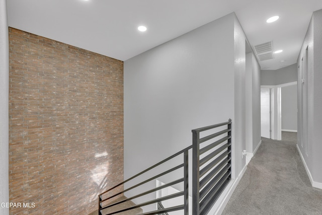 hall featuring baseboards, visible vents, carpet flooring, an upstairs landing, and recessed lighting