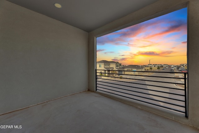 view of balcony at dusk