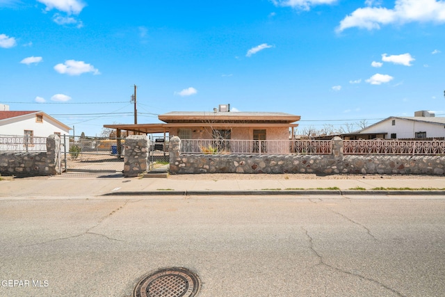 single story home featuring a gate and a fenced front yard