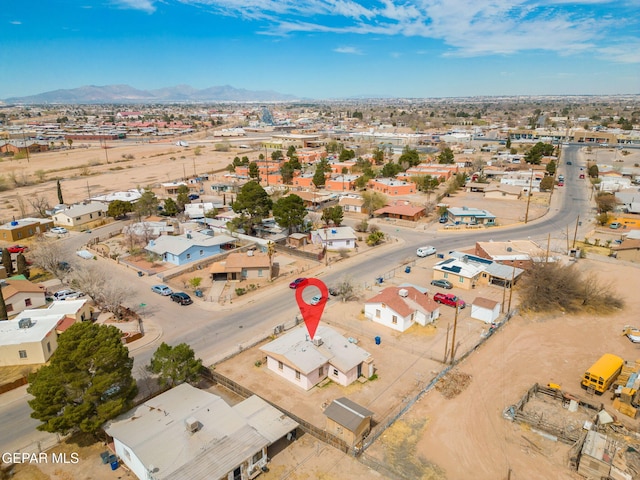 birds eye view of property with a mountain view and a residential view