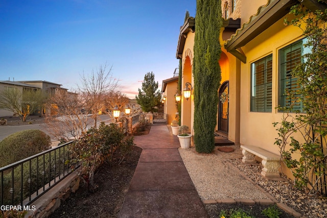 view of side of property with stucco siding