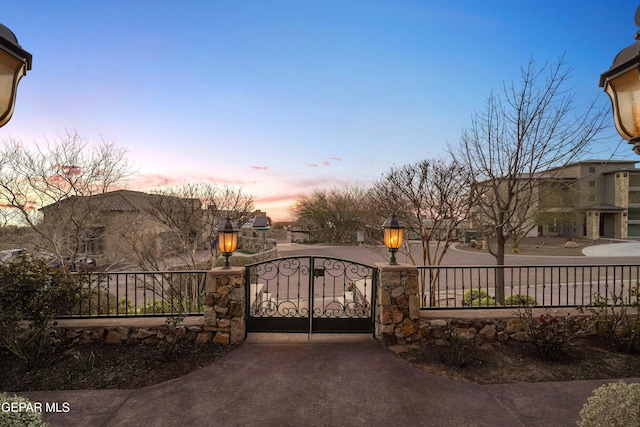 view of gate with fence