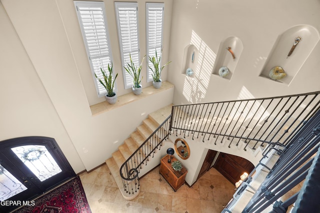 staircase with tile patterned flooring