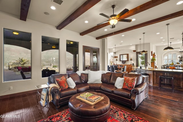 living room featuring beam ceiling, recessed lighting, dark wood-style flooring, and visible vents