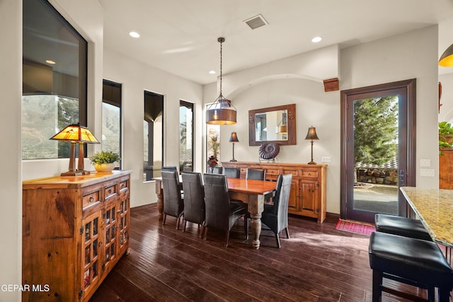 dining room with recessed lighting, visible vents, dark wood-style flooring, and baseboards