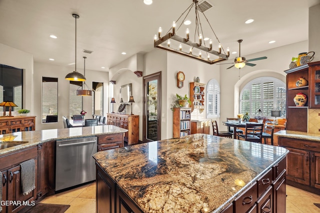 kitchen with visible vents, recessed lighting, a kitchen island, and stainless steel dishwasher